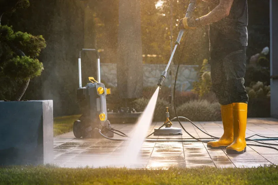 Technician power washing
